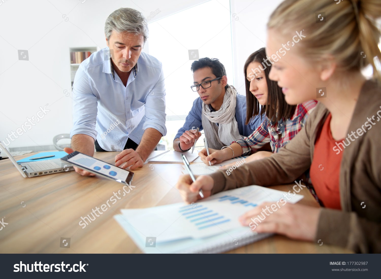 stock photo business school students in marketing class with teacher 177302987 1