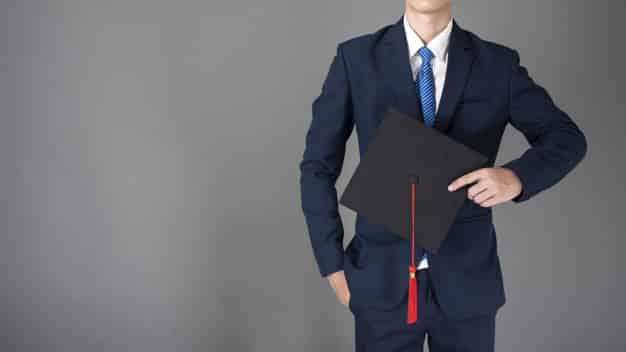 business man is holding graduation hat business education concept 33799 2212